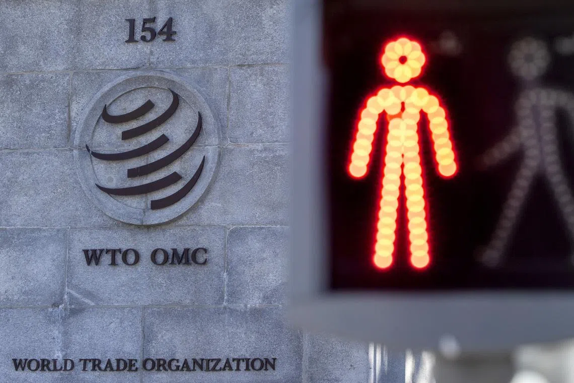 A logo is seen at the World Trade Organization (WTO) headquarters before a news conference in Geneva, Switzerland, October 5, 2022. REUTERS/Denis Balibouse
