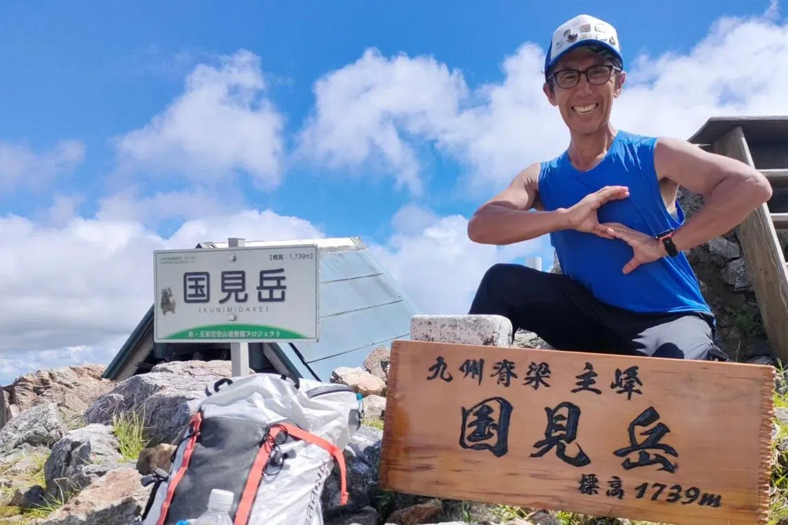 Mr Hiroaki Futagami on the summit of Mount Kunimidake in Fukui Prefecture, Japan.
