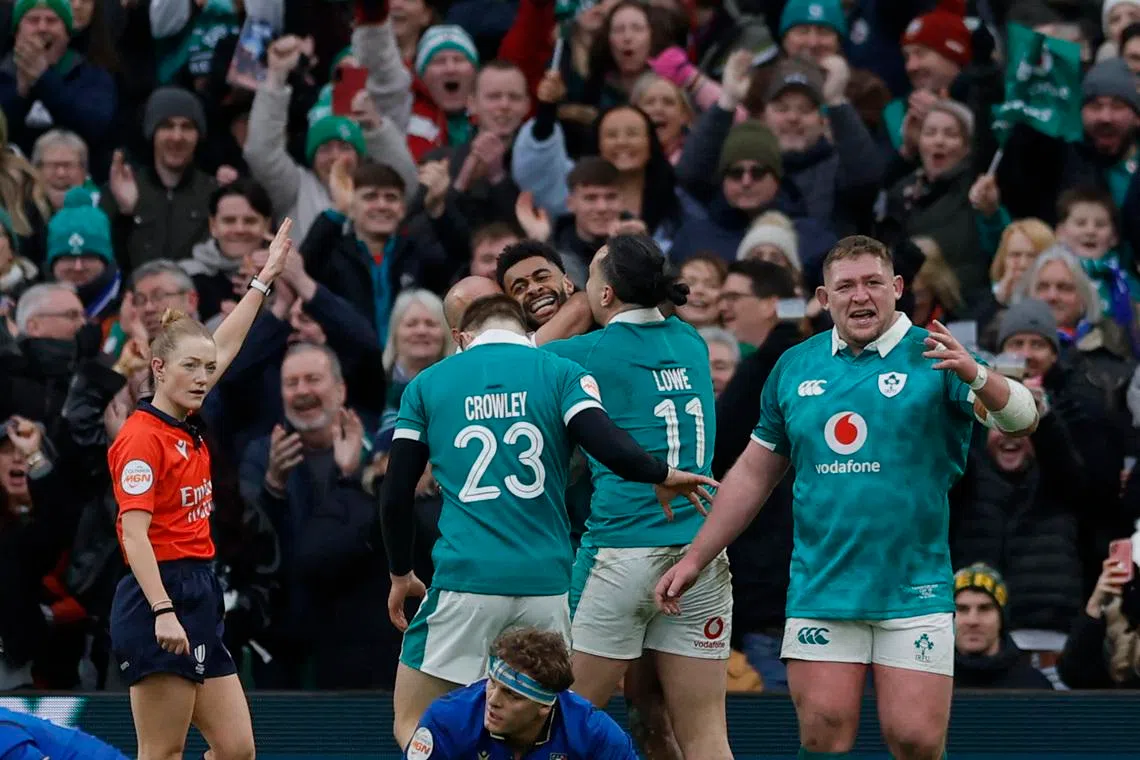 Rugby Union - Six Nations Championship - Ireland v Italy - Aviva Stadium, Dublin, Ireland - February 14, 2026 Ireland's Robert Baloucoune celebrates scoring their third try with teammates REUTERS/Clodagh Kilcoyne