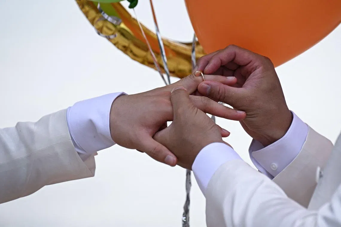 They are among the first Chinese LGBTQ pairs to tie the knot in the South-east Asian country as it celebrates its first Pride since the law’s passage.