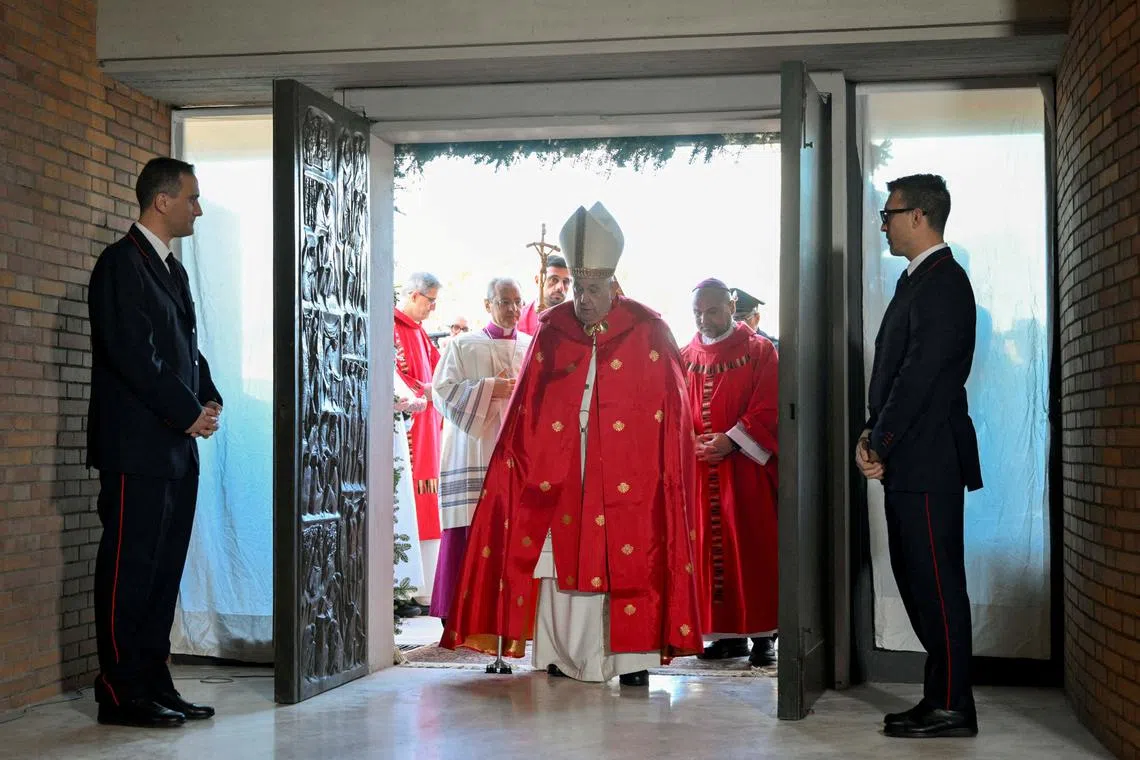 Pope Francis opens a Holy Door, one of only five that will be open during the 2025 Catholic Holy Year, at Rebibbia prison, in Rome, Italy, December 26, 2024.  Vatican Media/Simone Risoluti Handout via REUTERS