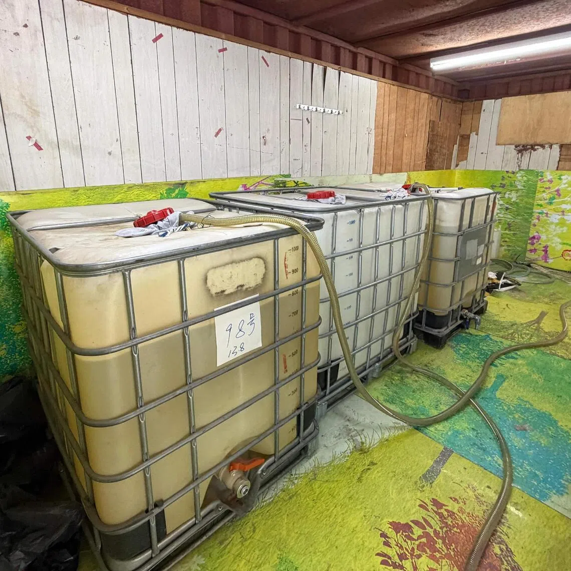 Motor spirit containers seized in an illicit fuel storage site during an anti-illicit fuel operation in Hong Kong.