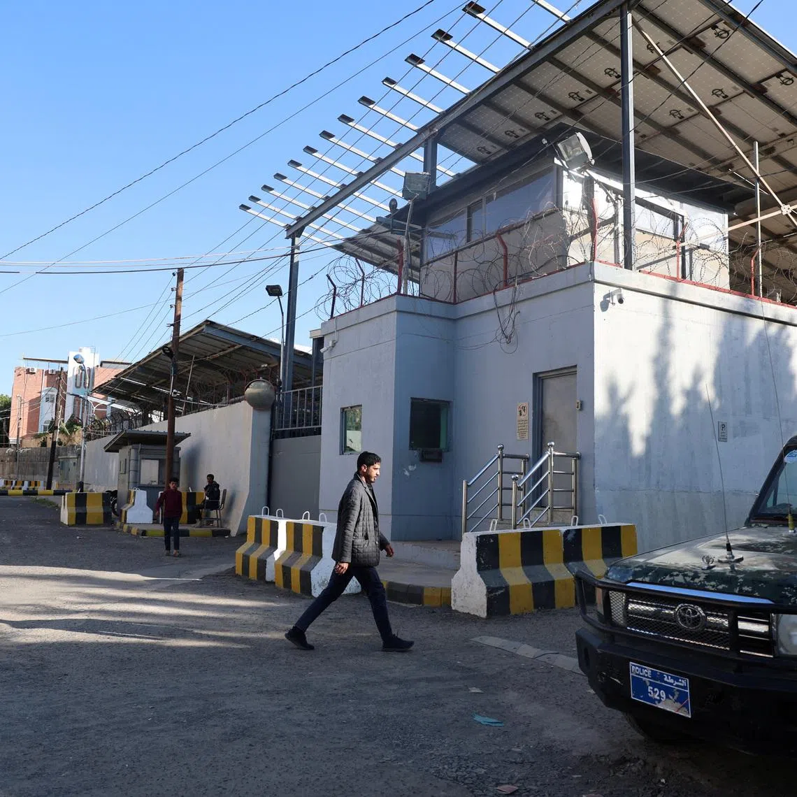 A man walks outside the United Nations compound following reports of UN staffers being detained by the Houthis, in Sanaa, Yemen October 29, 2025. REUTERS/Khaled Abdullah