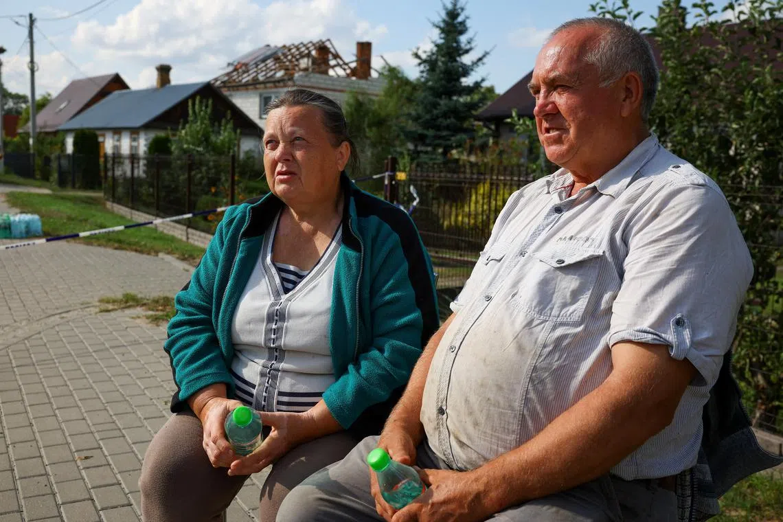 Alicja and Tomasz Wesolowski from Wyryki, whose house was destroyed after Russian drones violated Polish airspace during an attack on Ukraine, with some being shot down by Poland with the backing from its NATO allies, talk to Reuters outside their house, in Wyryki, Lublin Voivodeship, Poland, September 10, 2025. REUTERS/Kacper Pempel