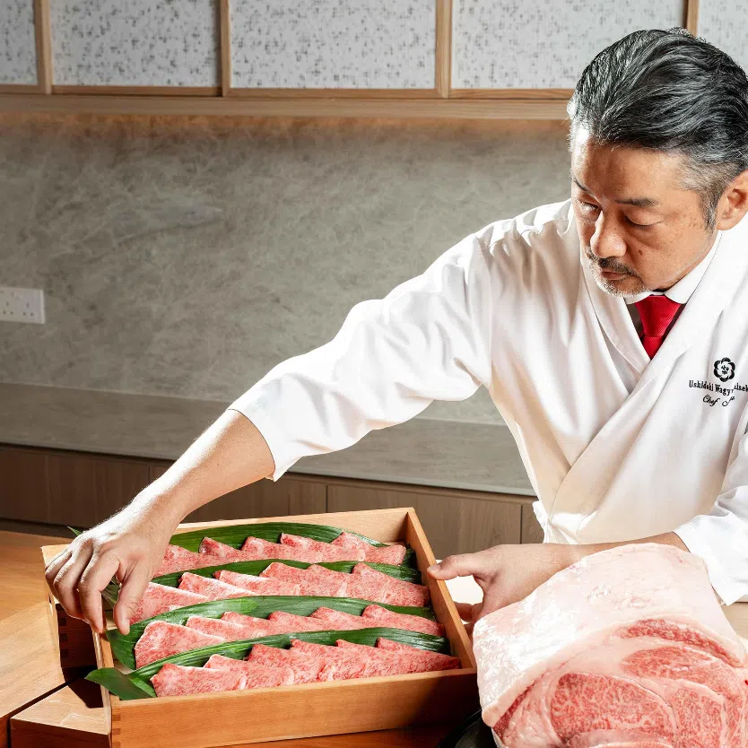 Chef Nobuaki Hirohashi of Ushidoki with the restaurant's star ingredient, Ozaki beef from Miyazaki Prefecture.