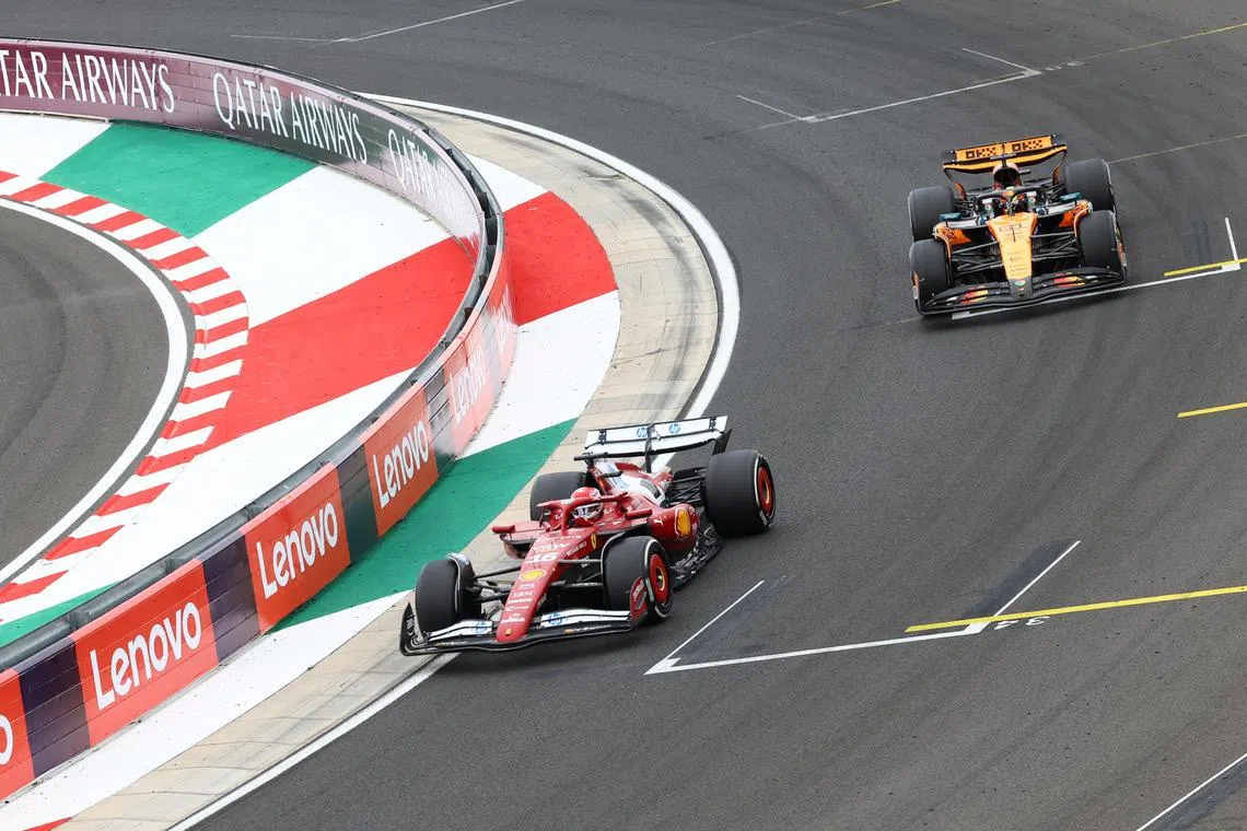 Ferrari's Charles Leclerc and McLaren's Oscar Piastri in action during the Hungarian Grand Prix.