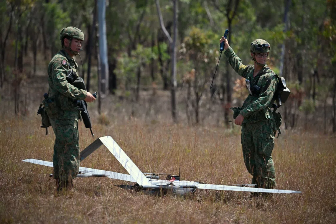 SAF soldiers from the Tactical Unmanned Aerial Vehicle Company preparing the V15 UAV for flight during Exercise Wallaby on Oct 26.