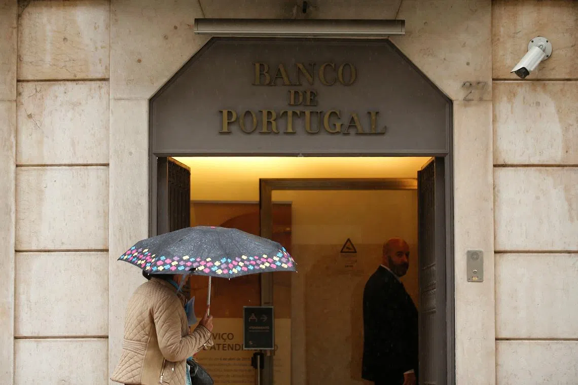 FILE PHOTO: A woman walks outside Bank of Portugal  in downtown Lisbon, Portugal, May 11, 2016.  REUTERS/Rafael Marchante/File Photo