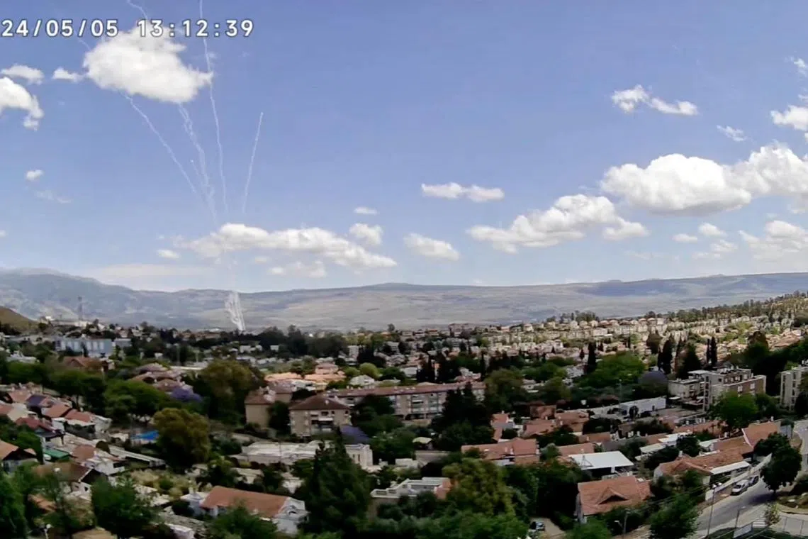 CCTV footage shows a barrage of rockets being fired from Lebanon, as seen from Kiryat Shmona, Israel, May 5, 2024 in this still image taken from video.   