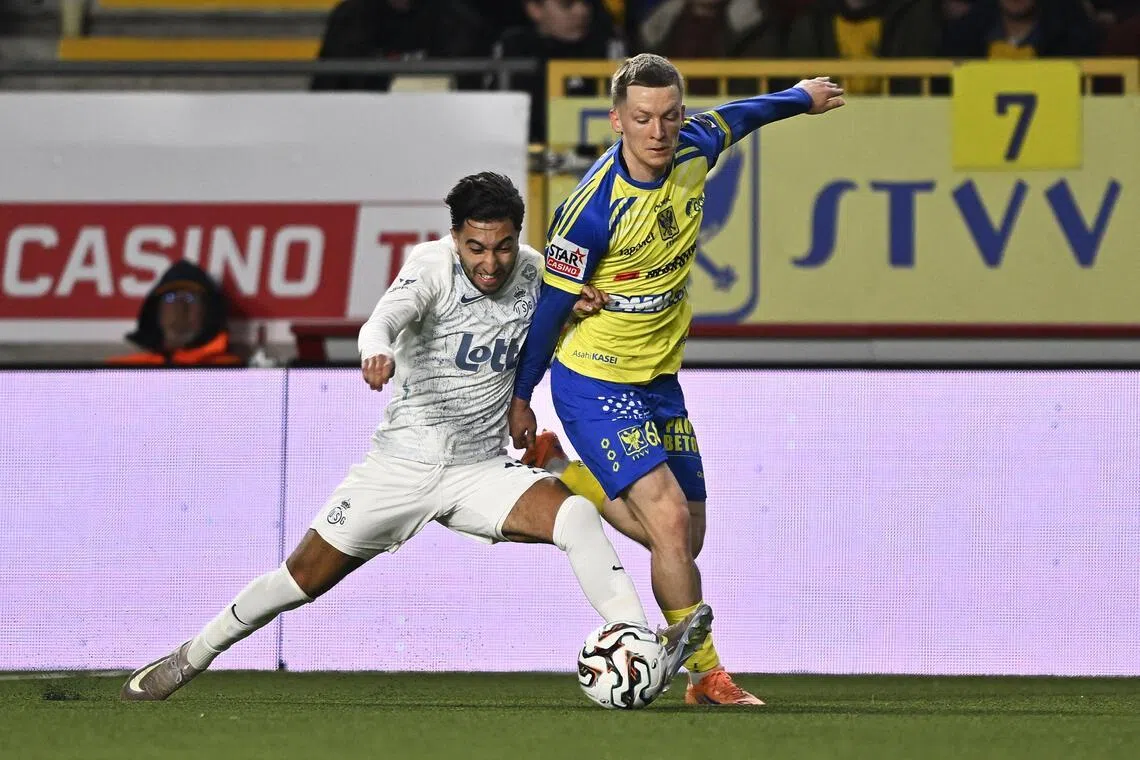 Union Saint-Gilloise midfielder Anouar Ait El Hadj trying to dispossess St Truiden defender Robert-Jan Vanwesemael in their Belgian ProLeague football match in Sint-Truiden on March 22, 2026.