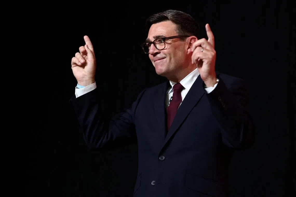 Andy Burnham gestures after being confirmed as the Labour Party’s new leader and the country’s next Prime Minister on July 17.