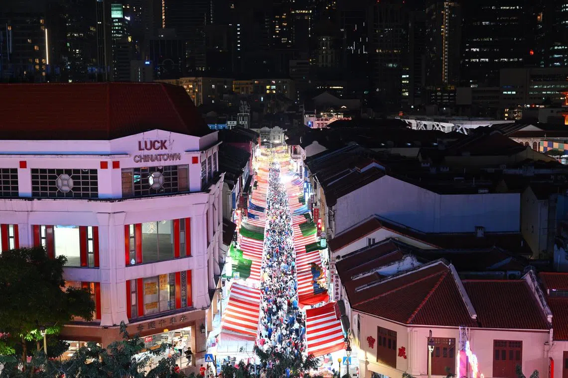 A large turnout at the Chinese New Year Bazaar in Chinatown as people come to complete their last-minute shopping on the eve of Chinese New Year on Feb 9.