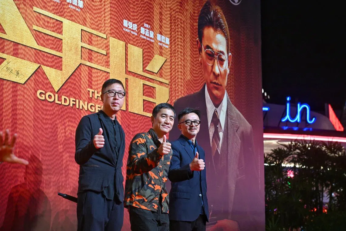 (From left) Director Felix Chong, actor Tony Leung and producer Ronald Wong at the red carpet event of The Goldfinger before the gala premiere of the movie at Universal Studios Singapore on Dec 21, 2023.