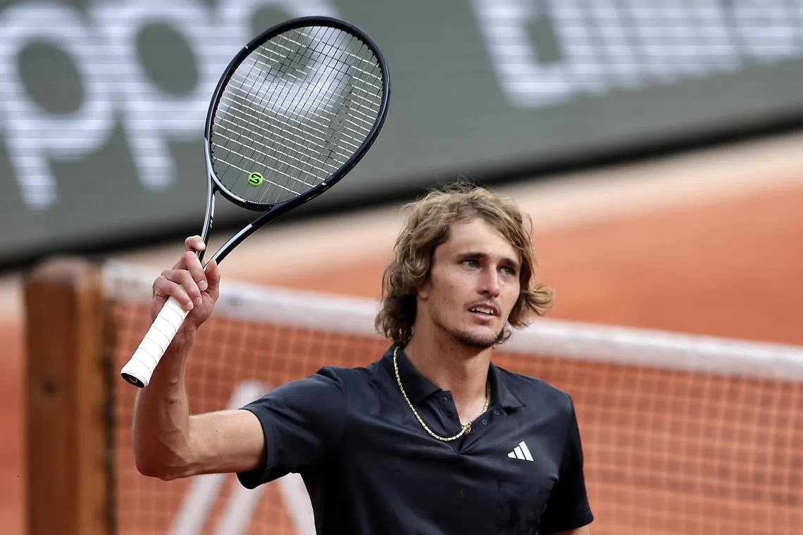 epa10678072 Alexander Zverev of Germany reacts after winning against Tomas Martin Etcheverry of Argentina in their Men's quarterfinal match during the French Open Grand Slam tennis tournament at Roland Garros in Paris, France, 07 June 2023.  EPA-EFE/CHRISTOPHE PETIT TESSON