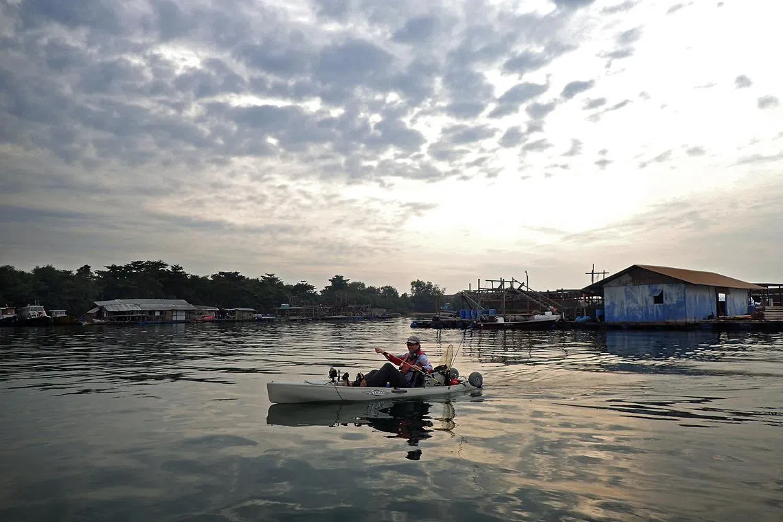 Mr Mervin Low, an avid kayak angler, setting up his fishing rod before he embarks on a day of kayak fishing in the waters off Pasir Ris. Mr Low, who enjoys getting away from the city’s hustle and bustle, has fished from a kayak for about six years. Kayak fishing is a growing phenomenon fuelled by a love of nature and the ability to access productive fishing spots not available to shore anglers.