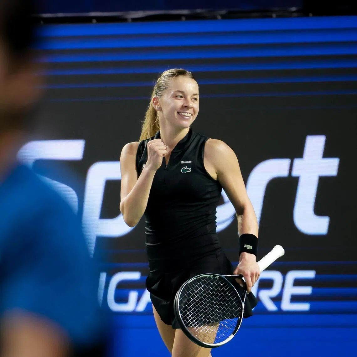 Belgium's Elise Mertens (purple) in action against Poland's Maja Chwalinska (black) during their women's singles quarter-final match at the Singapore Tennis Open on Sept 25, 2026.