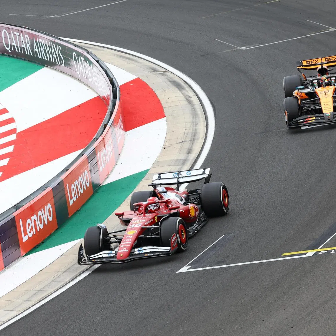 Ferrari's Charles Leclerc and McLaren's Oscar Piastri in action during the Hungarian Grand Prix.