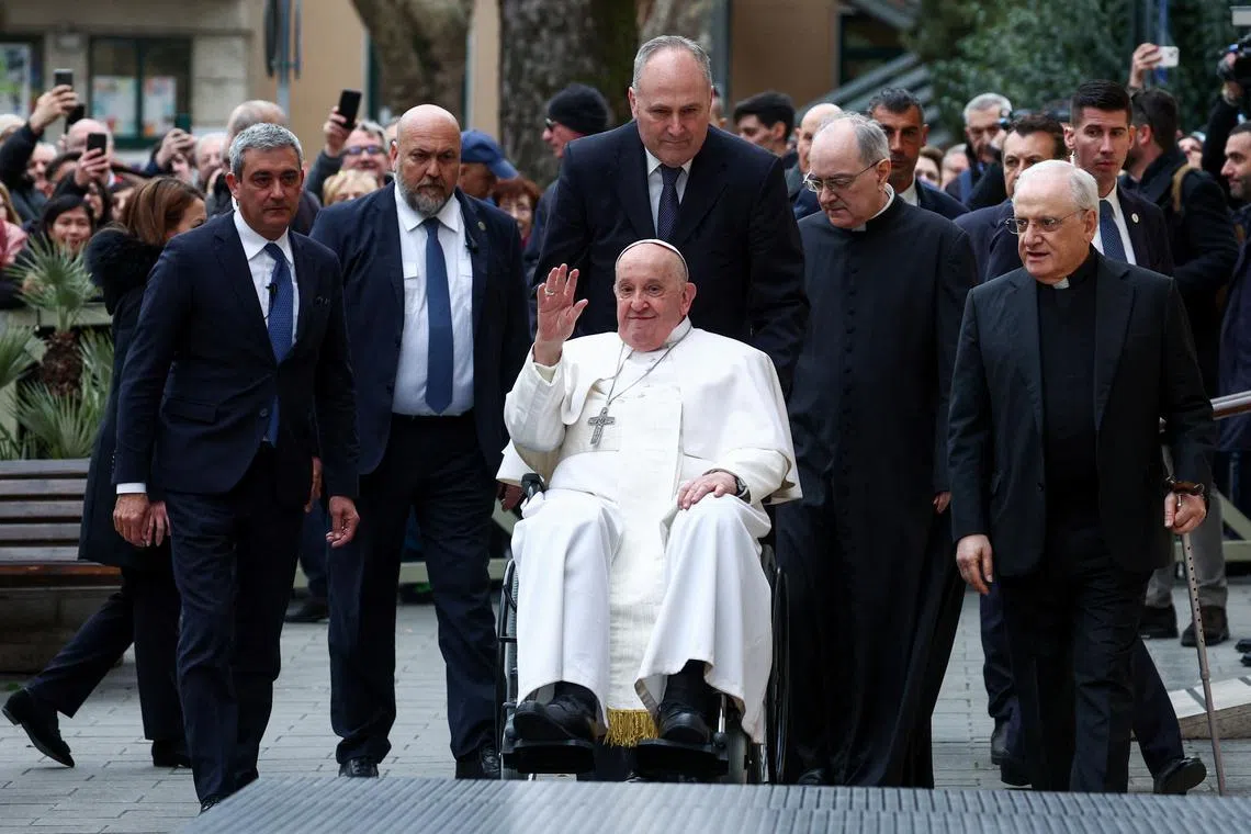 Pope Francis waves, on the day he presides over the '24 Hours for the Lord' Lenten initiative at the Roman parish of San Pio V, in Rome, Italy, March 8, 2024. REUTERS/Guglielmo Mangiapane