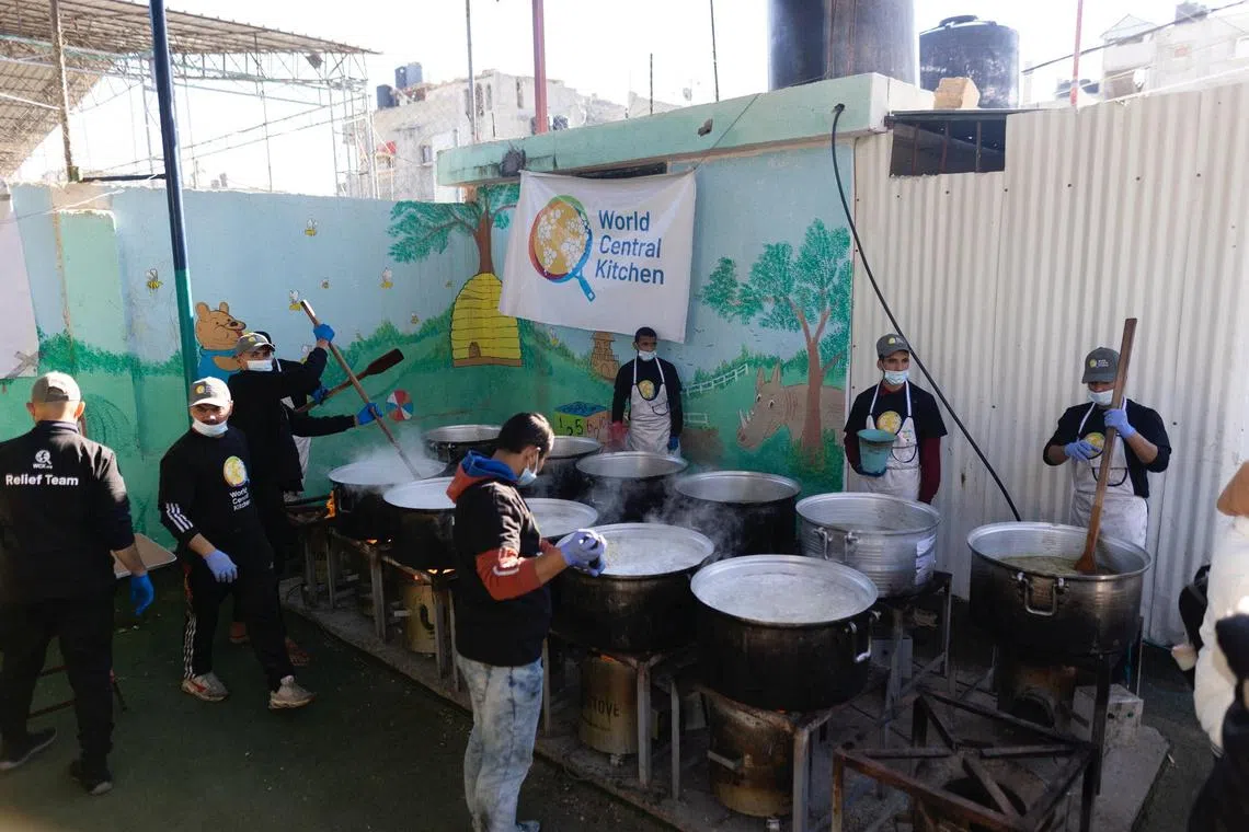 FILE PHOTO: Members of \"World Central Kitchen\" prepare food for Palestinians, in the location given as Gaza, amid the ongoing conflict between Israel and Hamas, in this picture released on March 21, 2024 and obtained from social media. Courtesy of @chefjoseandres via X/via REUTERS/File Photo