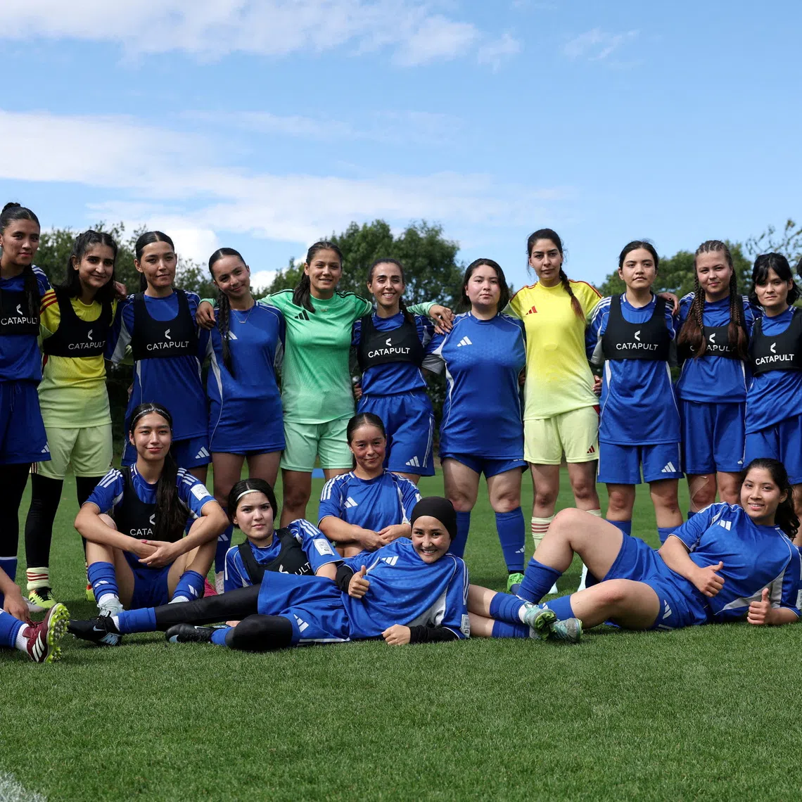Soccer Football - Members of the Afghan Women's Refugee team pose for a team group during a selection camp at St. George's Park, Burton upon Trent, Britain - August 26, 2025 REUTERS/John Sibley/File Photo