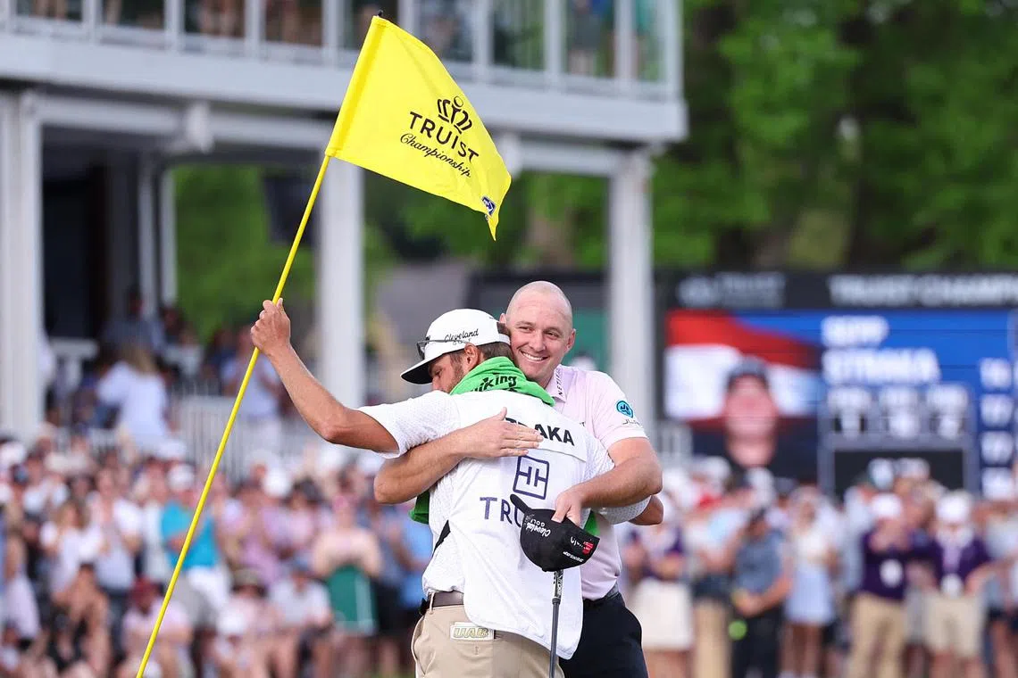 Sepp Straka hugs his caddie after winning the Truist Championship.