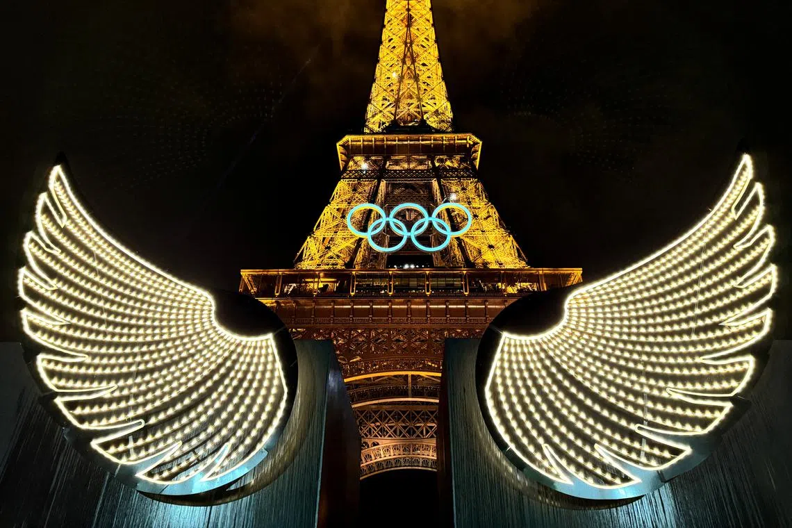 Paris 2024 Olympics - Opening Ceremony - Paris, France - July 26, 2024. A general view showing wings and the Olympic rings on the Eiffel Tower during the opening ceremony. REUTERS/Pawel Kopczynski / File Photo