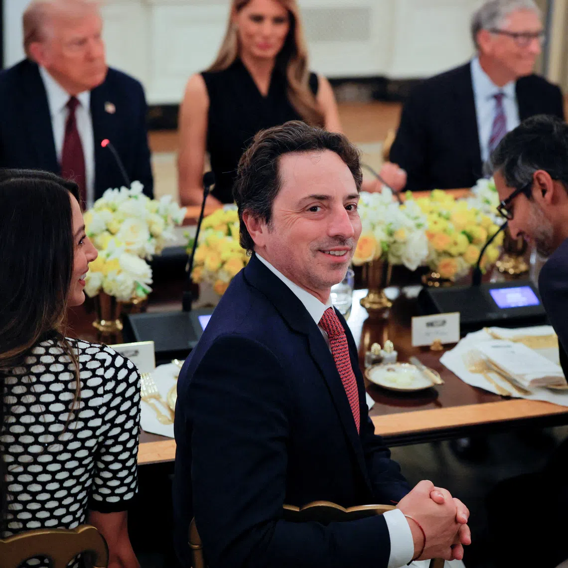 FILE PHOTO: Google cofounder Sergey Brin attends a private dinner for technology and business leaders hosted by U.S. President Donald Trump in the State Dining Room at the White House in Washington, D.C., U.S., September 4, 2025.  REUTERS/Brian Snyder/File Photo