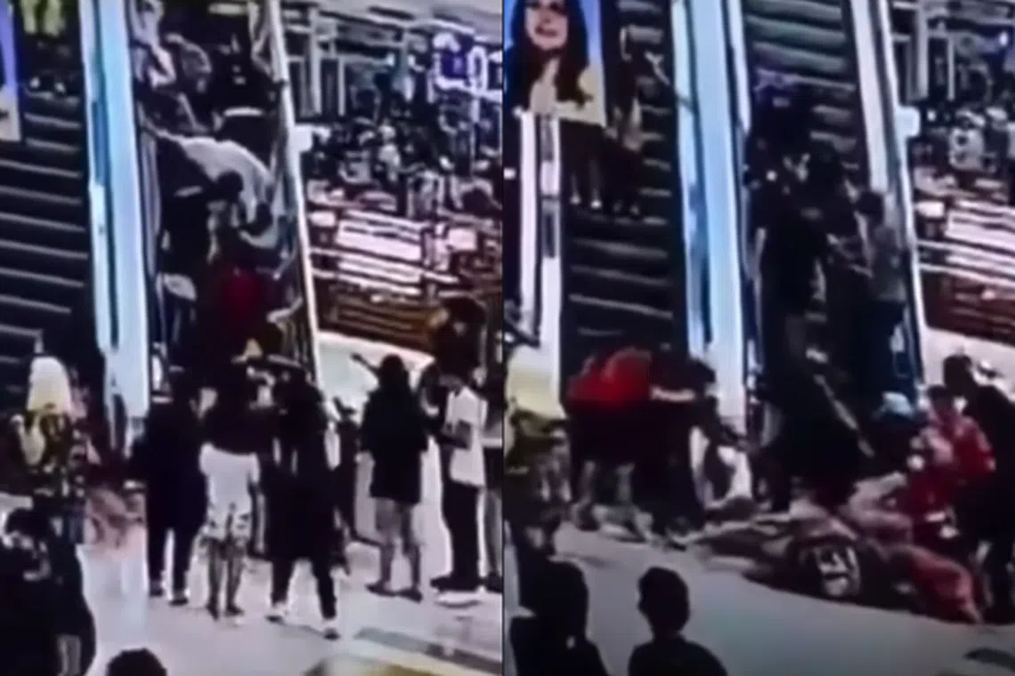 Screenshots from a YouTube video show a pile-up at the foot of an escalator inside a sprawling mall in the Philippines that abruptly slid backward. 