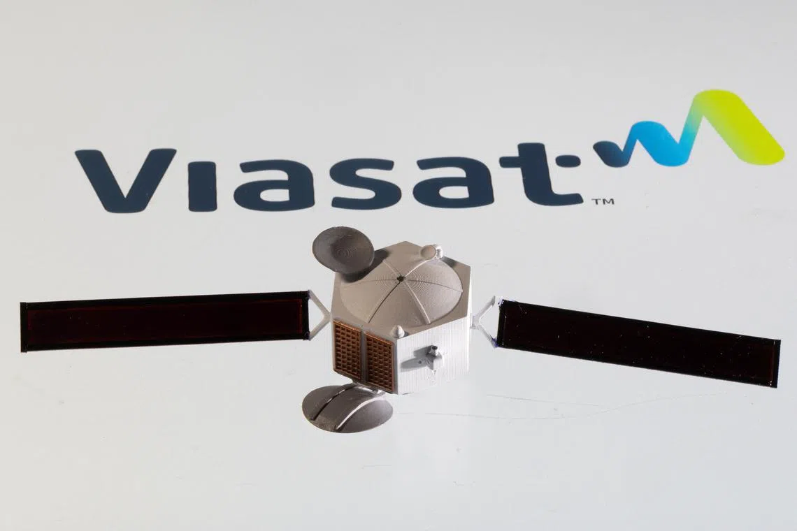 FILE PHOTO: Satellite model is placed on Viasat logo in this picture illustration taken April 4, 2022. REUTERS/Dado Ruvic/Illustration/File Photo