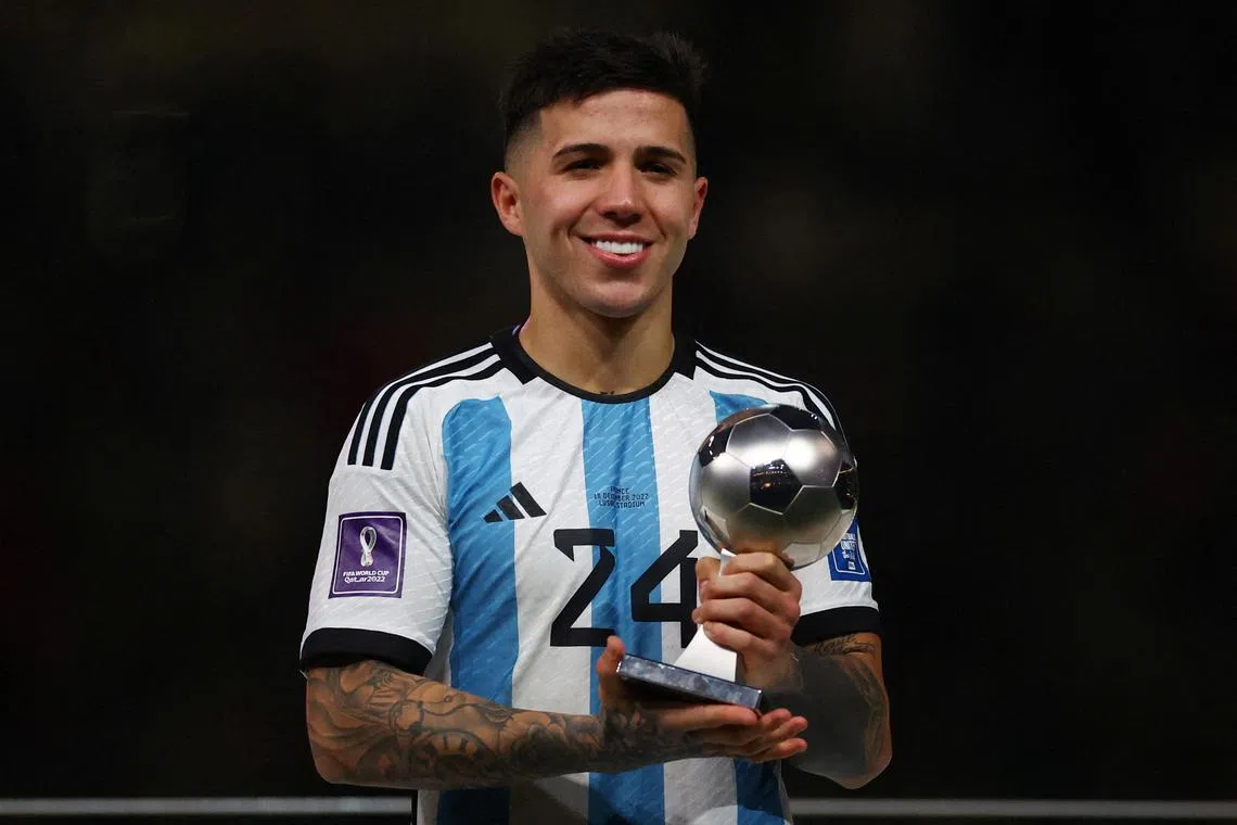Argentina's Enzo Fernandez poses with his best young player award at the World Cup in Qatar.