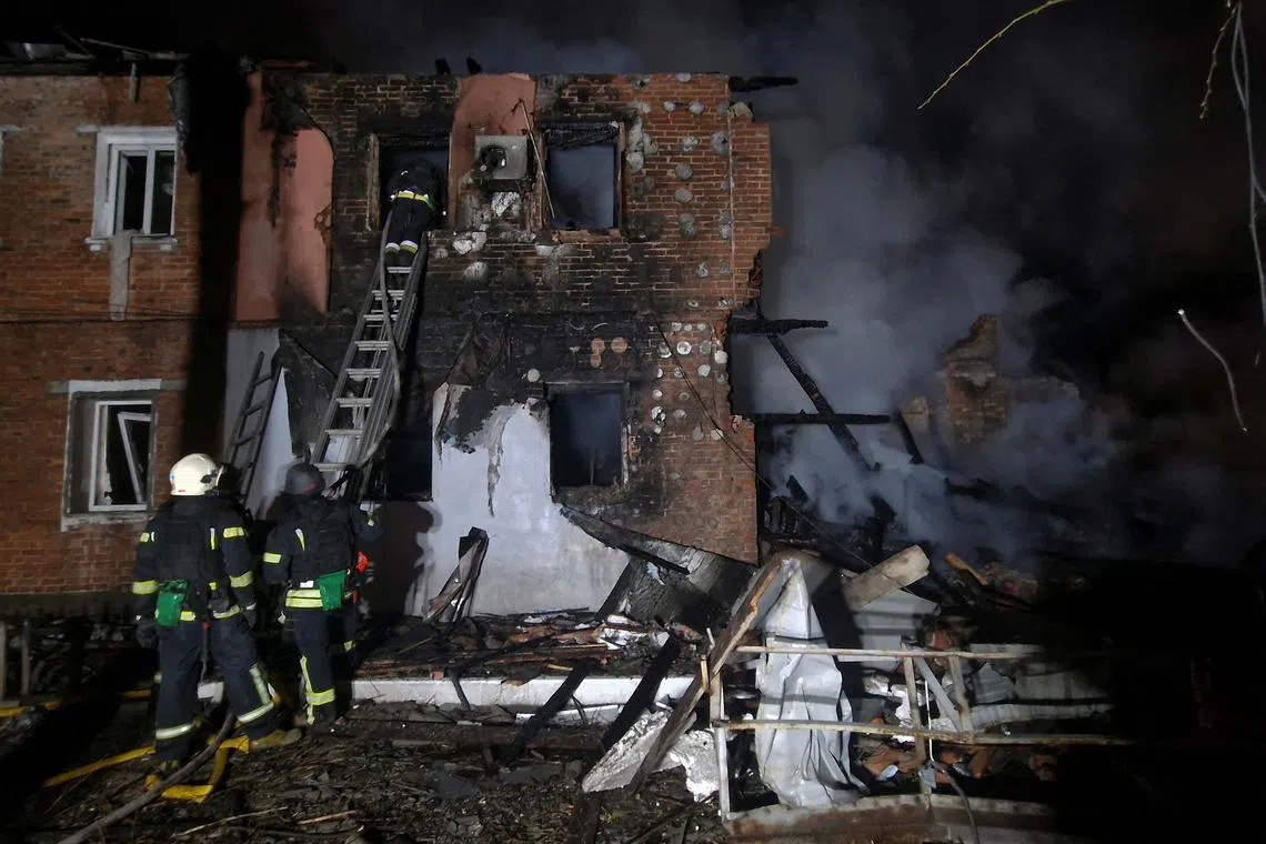 Rescuers work at the site of an apartment building damaged by a Russian drone strike, amid Russia's attack on Ukraine, in Kharkiv, Ukraine April 3, 2025. REUTERS/Vyacheslav Madiyevskyy