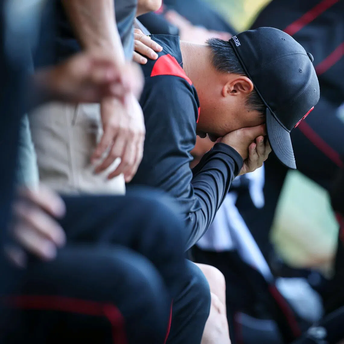 Team Singapore feeling despondent after losing 3-0 to Philippines in the men's softball team final at the SEA Games, held at the Queen Sirikit Sports Center Baseball Stadium in Bangkok on Dec 18, 2025. ST PHOTO: BRIAN TEO