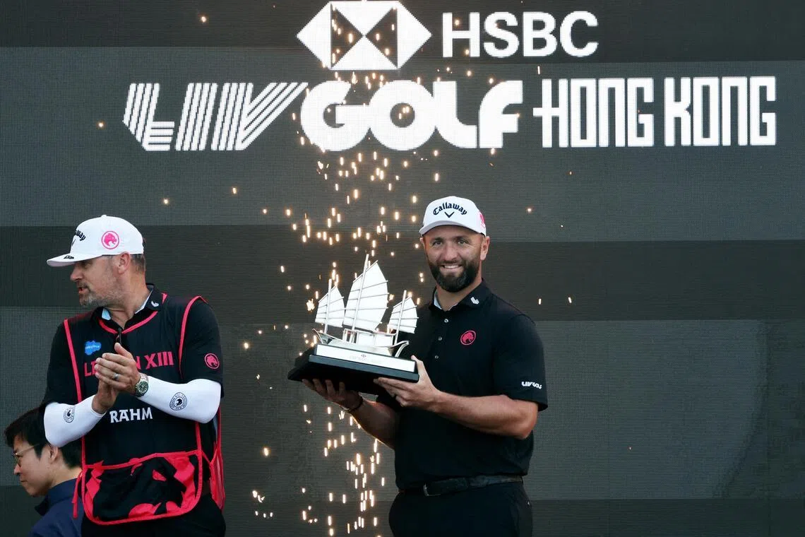 Legion XIII's Jon Rahm celebrating with the trophy after winning LIV Golf Hong Kong in March 2026.