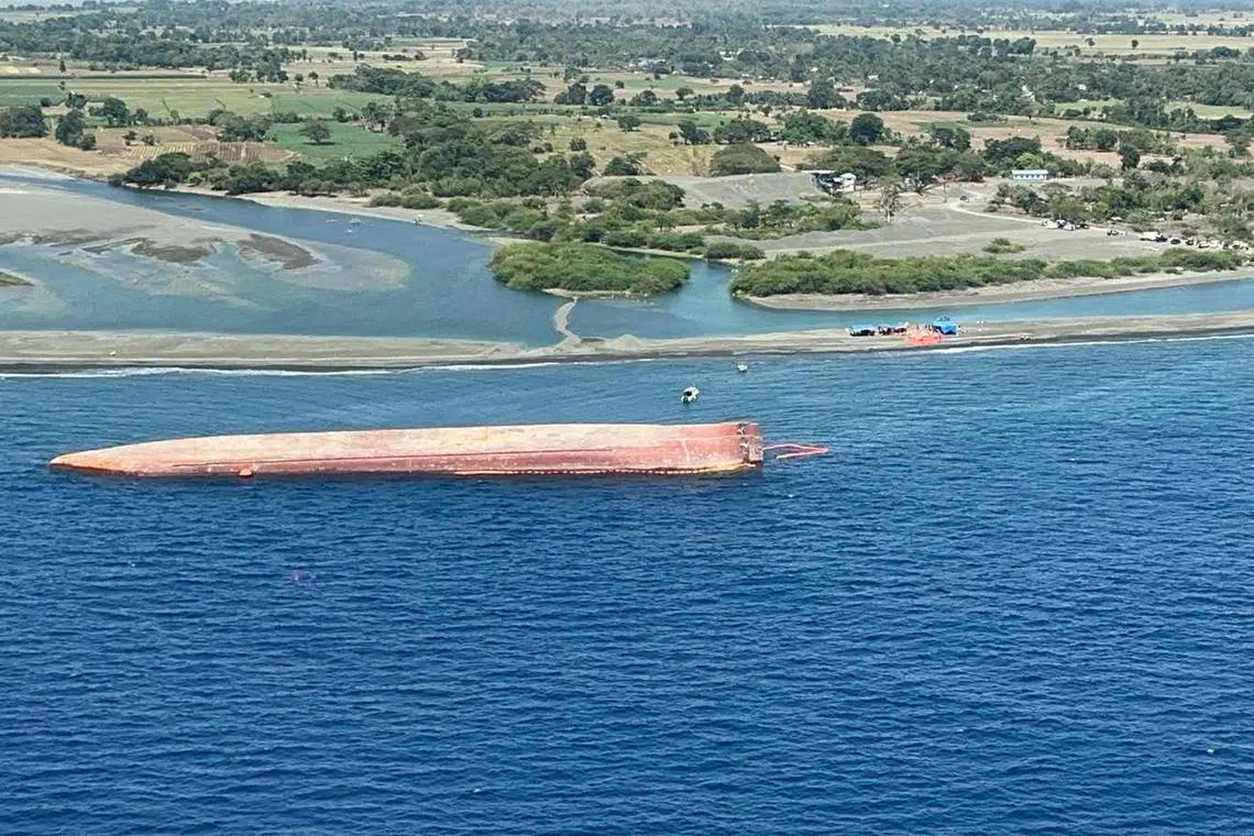 FILE PHOTO: An aerial photo shows MV Hong Hai 16 dredging vessel, which capsized in the waters off the coast of Occidental Mindoro, Philippines, in a handout photo released by the Philippine Coast Guard on April 16, 2025. Philippine Coast Guard/Handout via REUTERS