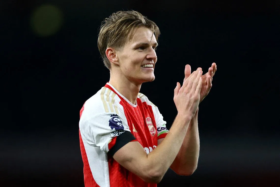 FILE PHOTO: Soccer Football - Premier League - Arsenal v Chelsea - Emirates Stadium, London, Britain - April 23, 2024 Arsenal's Martin Odegaard celebrates after the match Action Images via Reuters/Matthew Childs/File Photo