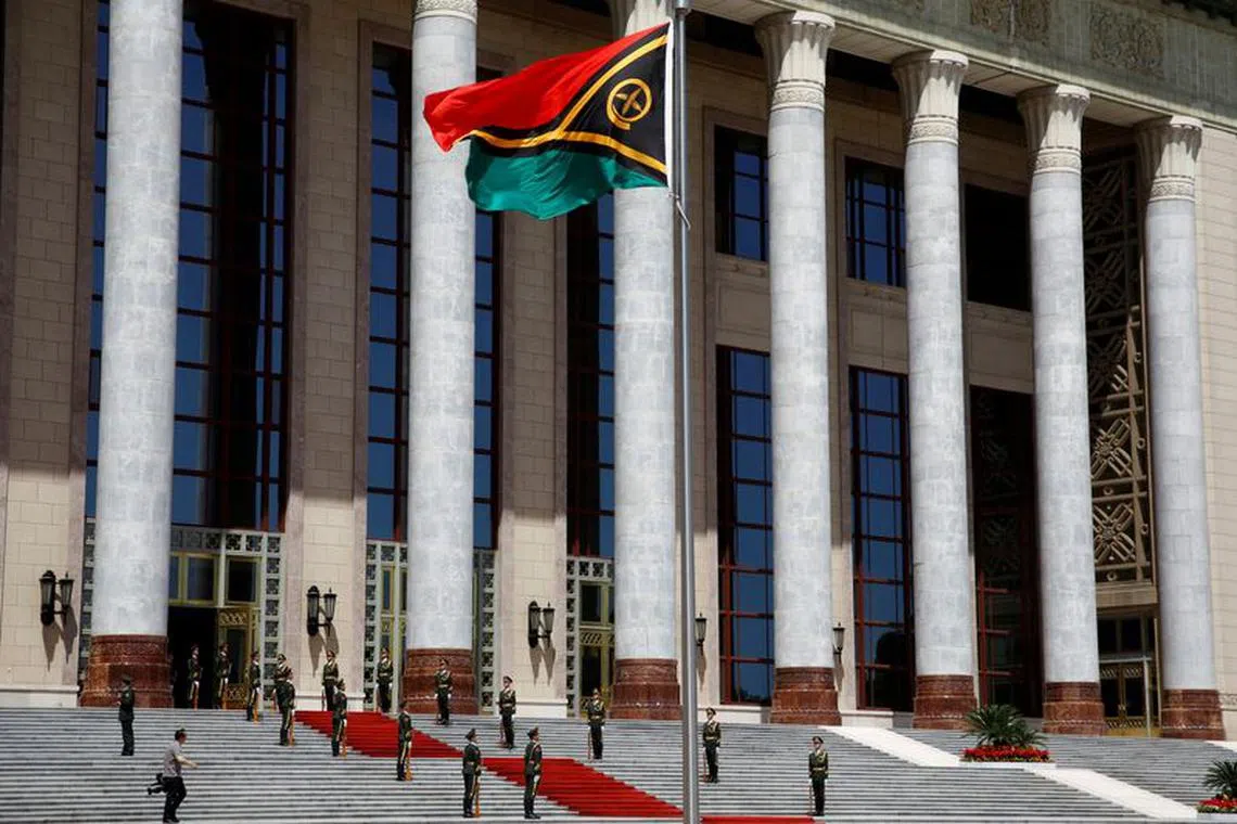 FILE PHOTO: A Vanuatu flag flutters outside the Great Hall of the People before a welcome ceremony for Vanuatu Prime Minister Charlot Salwai in Beijing, China May 27, 2019. REUTERS/Florence Lo/File Photo