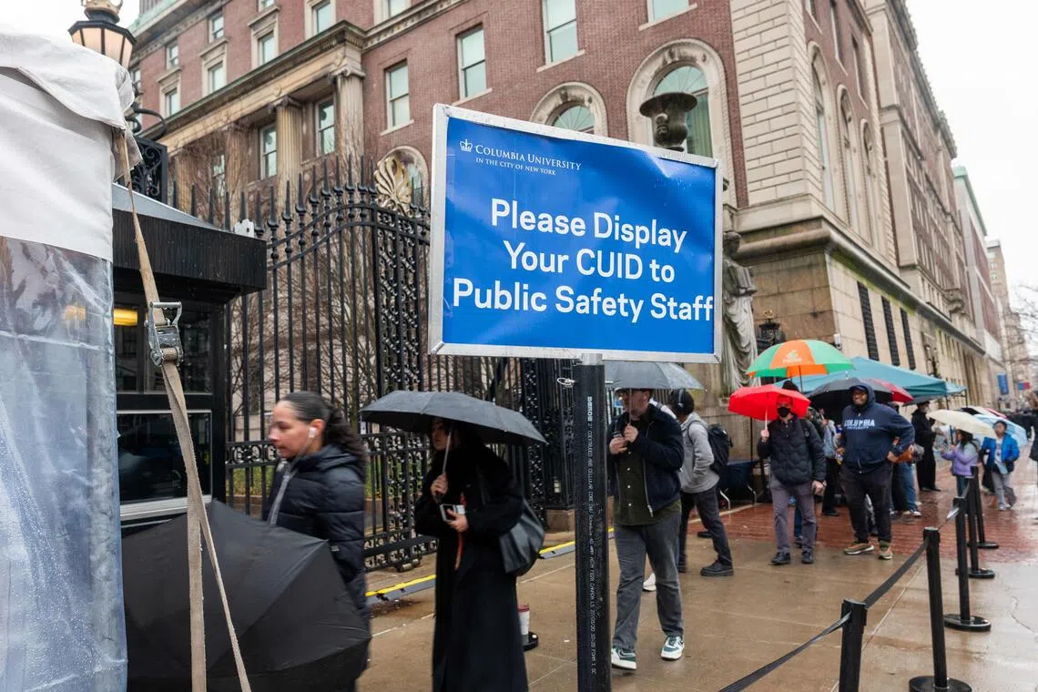 NEW YORK, NEW YORK - MARCH 24: Students wait in long security lines outside of Columbia University as demonstrators continue to rally in support of Palestine and to protest the arrest and detention of Mahmoud Khalil, a green card holder who played a role in pro-Palestinian protests, outside of Columbia University on March 24, 2025 in New York City. Protests were also over the university's recent agreement with the Trump administration to overhaul its protest policies, security practices and Middle Eastern studies department to continue receiving $400 million in federal funding.   Spencer Platt/Getty Images/AFP (Photo by SPENCER PLATT / GETTY IMAGES NORTH AMERICA / Getty Images via AFP)