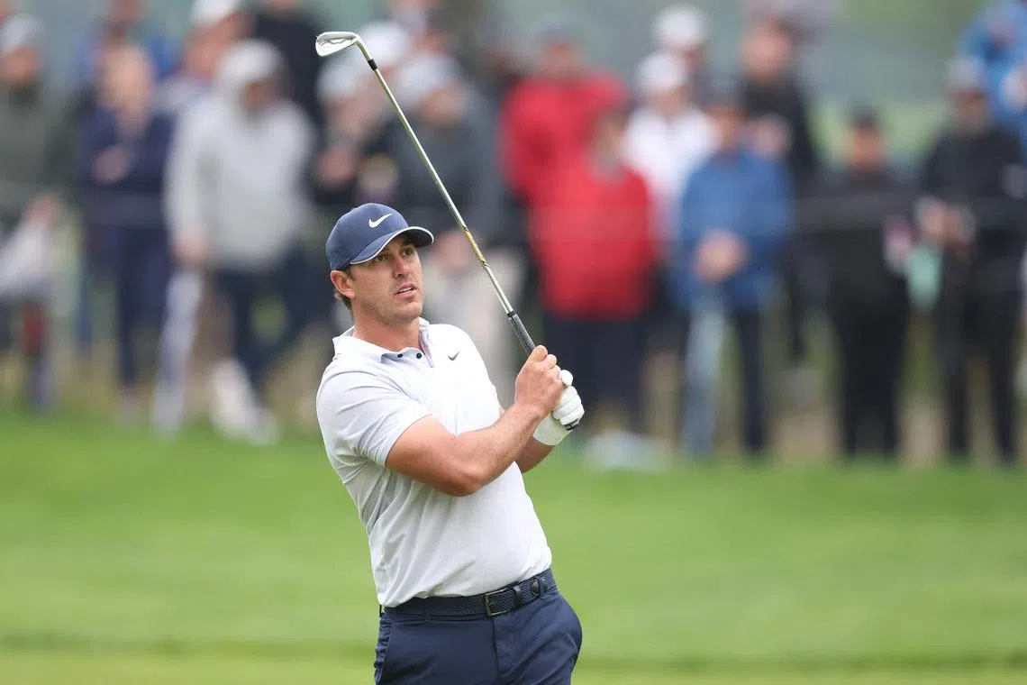 Brooks Koepka plays a second shot on the 18th hole during the third round of the 2023 PGA Championship at Oak Hill Country Club.