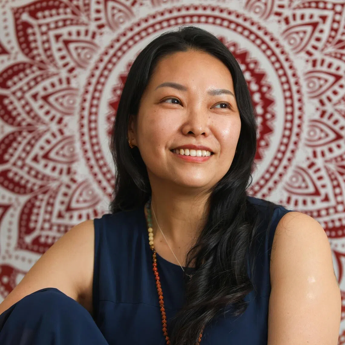 Ms Laurine Lim, 49, set up a yoga and wellness studio, Laya Studio, after yoga helped her heal from perimenopause symptoms. 