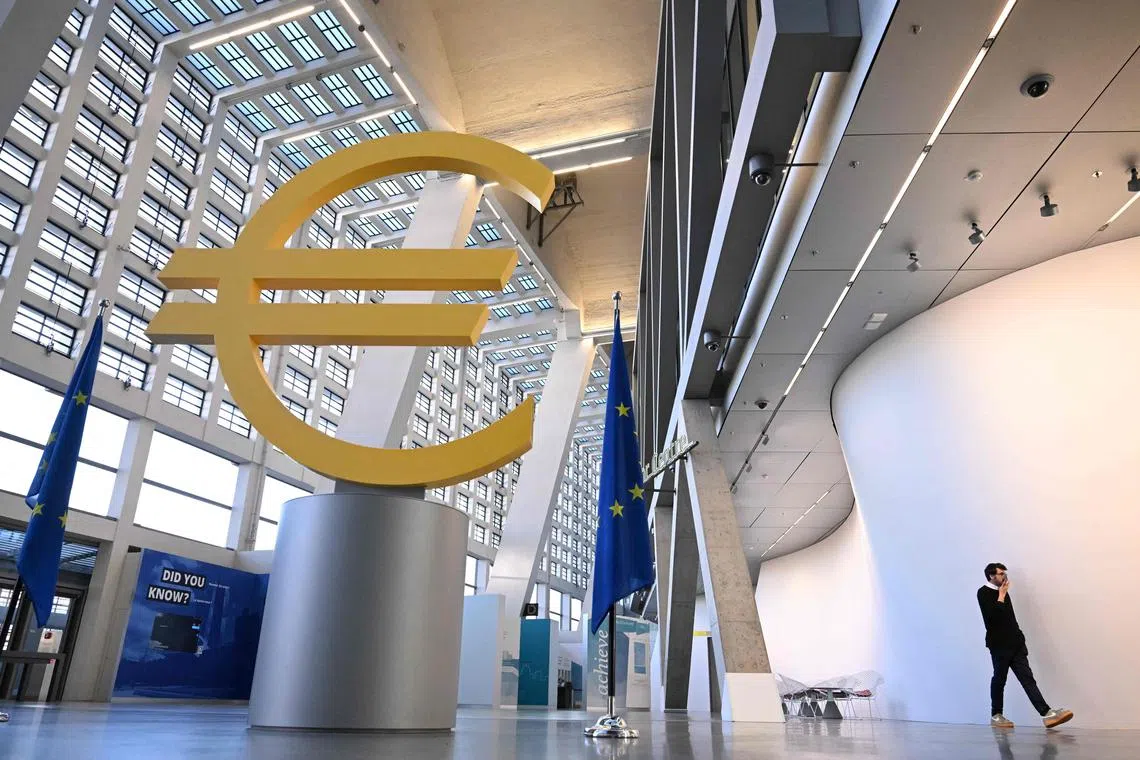 A giant Euro sculpture is pictured at the headquarters of the European Central Bank (ECB) prior to a press conference on the Eurozone's monetary policy in Frankfurt am Main, western Germany, on January 30, 2025. (Photo by Kirill KUDRYAVTSEV / AFP)