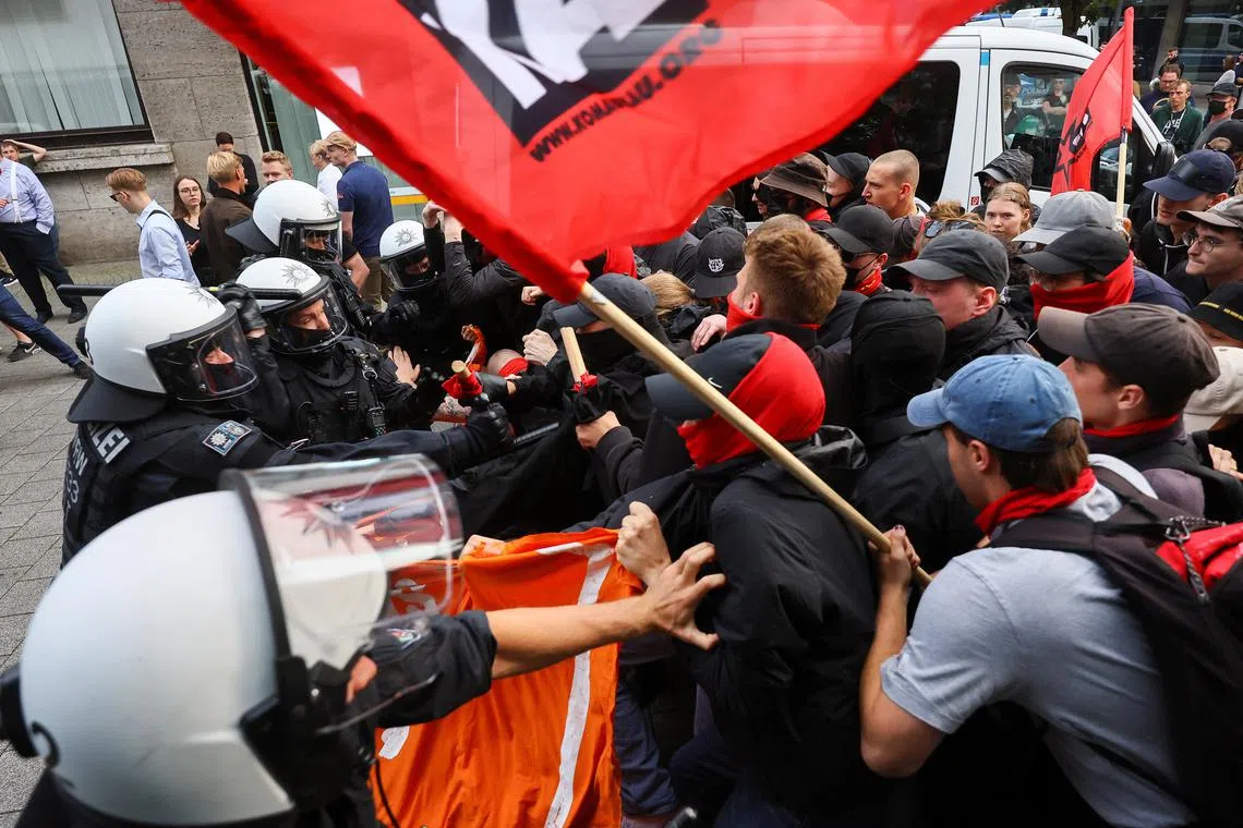 German police push back left-wing protesters in the western German city of Solingen, following a stabbing rampage, on Aug 25, 2024.