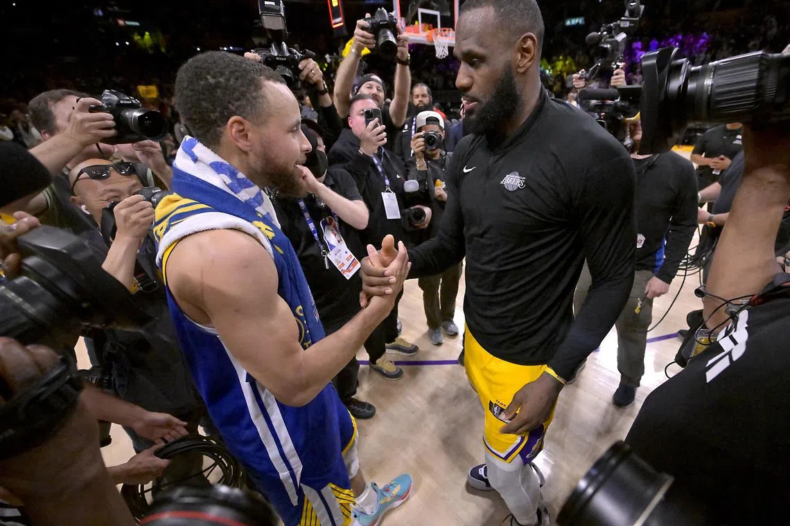 Los Angeles Lakers forward LeBron James and Golden State Warriors guard Stephen Curry embracing after game six of the 2023 NBA play-offs at Crypto.com Arena.