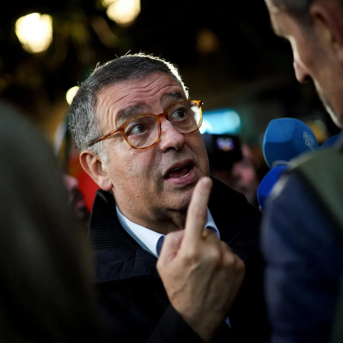 Antonio Jose Seguro, presidential candidate for the January 18 election and former Secretary General of the Socialist Party, speaks with a person during a rally in Setubal, Portugal, January 13, 2026. REUTERS/Pedro Nunes