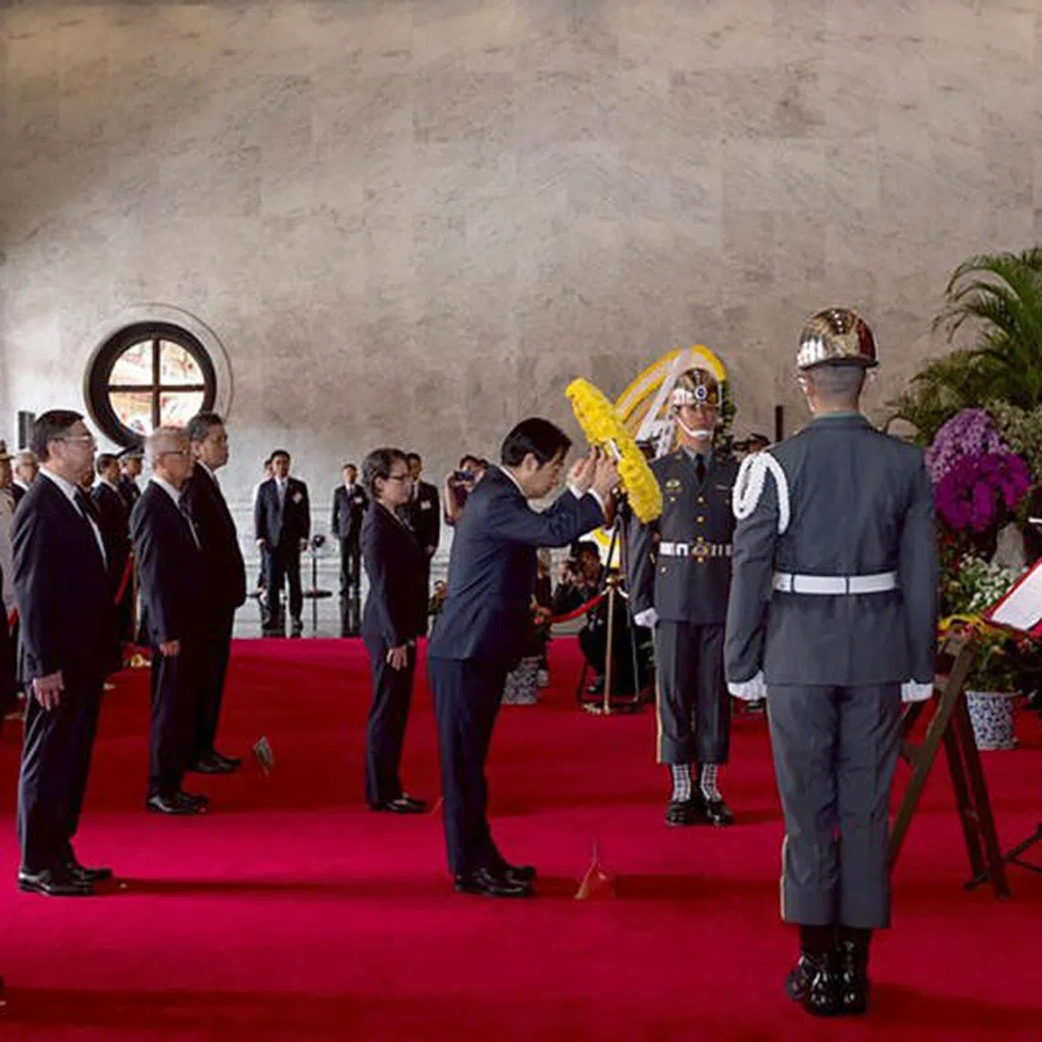Taiwanese President Lai Ching-te laying flowers at the memorial tablets of the martyrs of the National Revolution.
