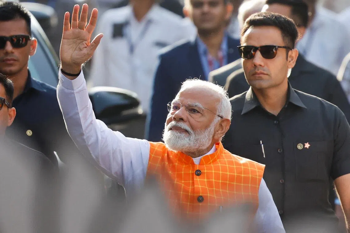India's Prime Minister Narendra Modi waves on the day he votes during the third phase of the general election, in Ahmedabad, India, May 7, 2024. REUTERS/Adnan Abidi