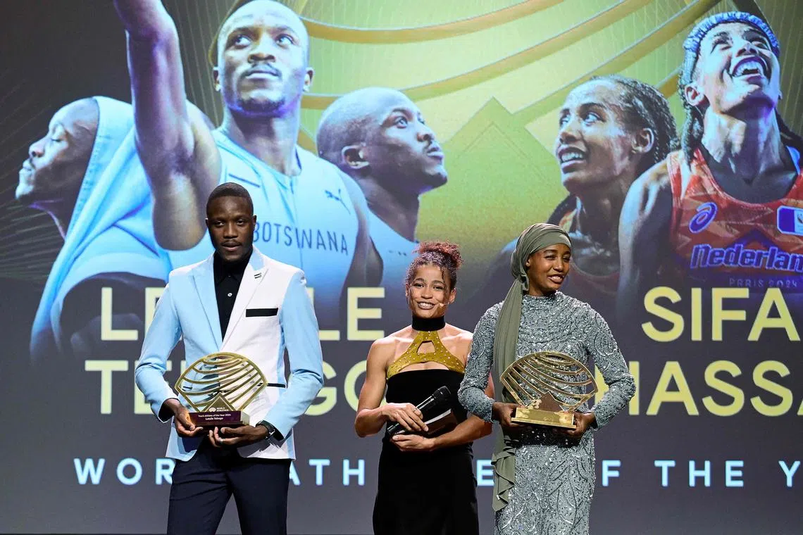 Botswanan sprinter Letsile Tebogo (left) holding his the Men’s Track Athlete of the Year Award and Dutch middle and long-distance runner Sifan Hassan (right) holding her the Women’s Out of Stadium Athlete of the Year Award pose on stage during the World Athletics Awards 2024 in Monaco on Dec 1.