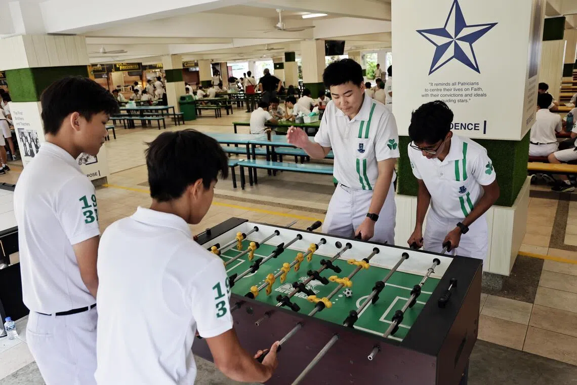 St Patrick’s school students playing foosball during recess time.