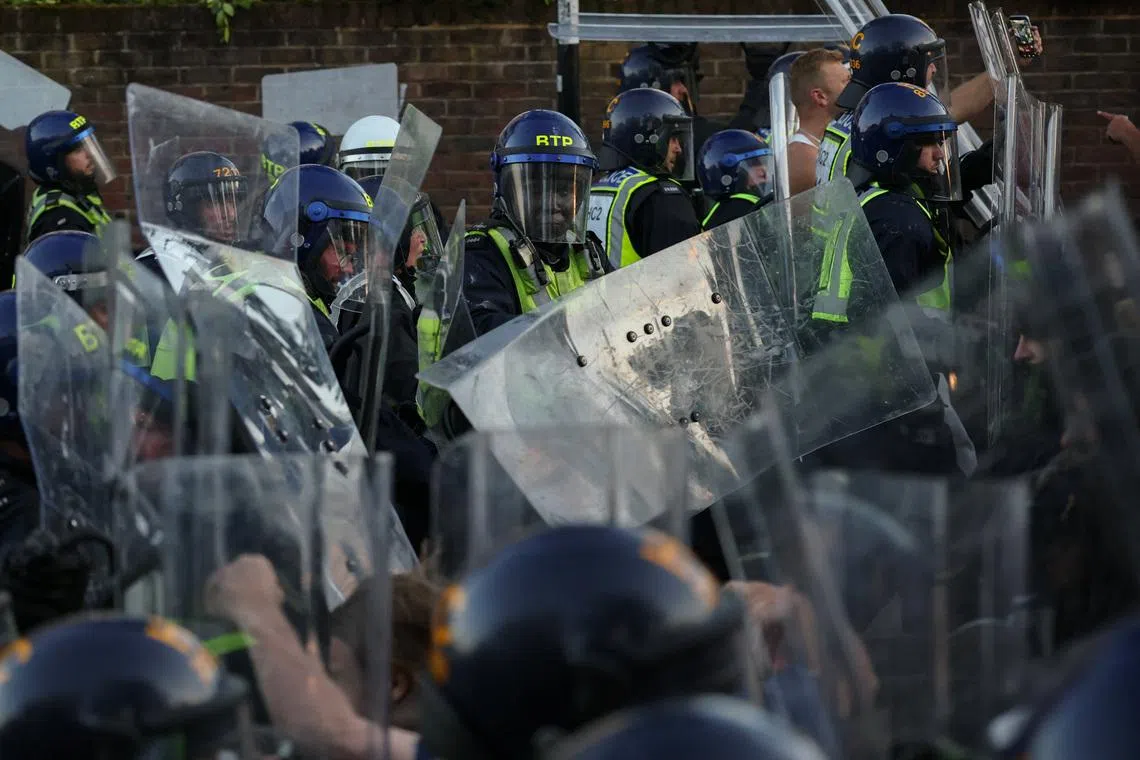 Protesters clash with police officers during a demonstration following the conviction of Vikrum Digwa for the murder of student Henry Nowak, in Southampton, Britain, June 2.