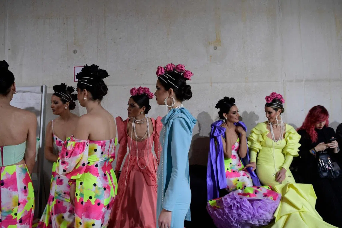 Models get ready backstage before presenting creations during the Simof 2023 (International Flamenco Fashion Show) in Sevilla on Jan 28, 2023. 