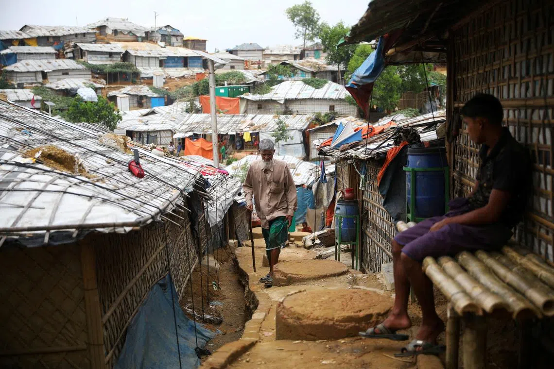 A Rohingya refugee walks at a refugee camp in Cox's Bazar, Bangladesh.